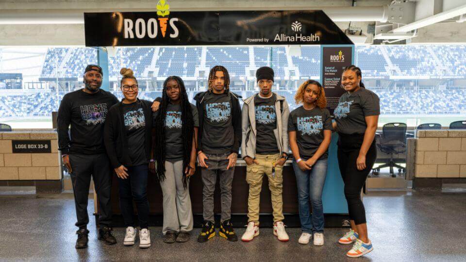 Nonprofit partner Roots for the Home Team - kiosk and Roots crew at Allianz Field