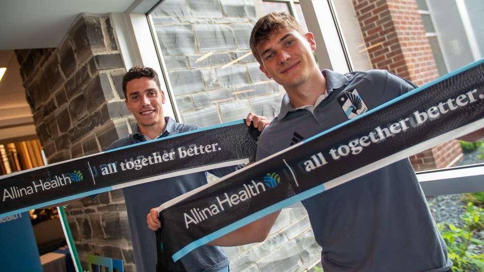 MNUFC players help to celebrate Lakeville Specialty Center Grand Opening